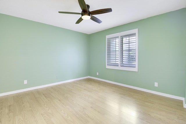 spare room with ceiling fan and light hardwood / wood-style flooring