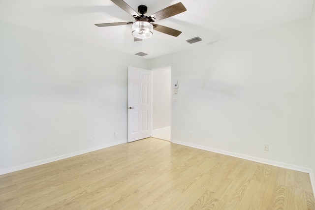 unfurnished room featuring light wood-type flooring and ceiling fan