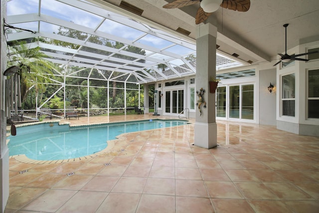 view of pool featuring a lanai, a patio area, and ceiling fan