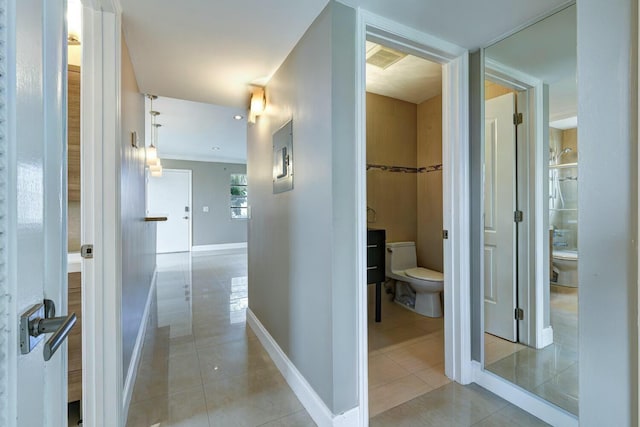 corridor featuring light tile patterned flooring