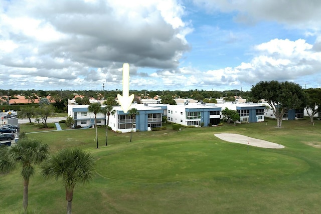 view of property's community featuring a lawn