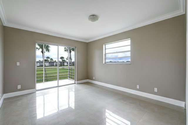 unfurnished room with crown molding and light tile patterned floors