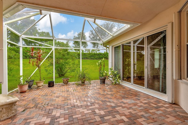 view of patio / terrace featuring glass enclosure