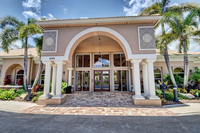 entrance to property featuring french doors