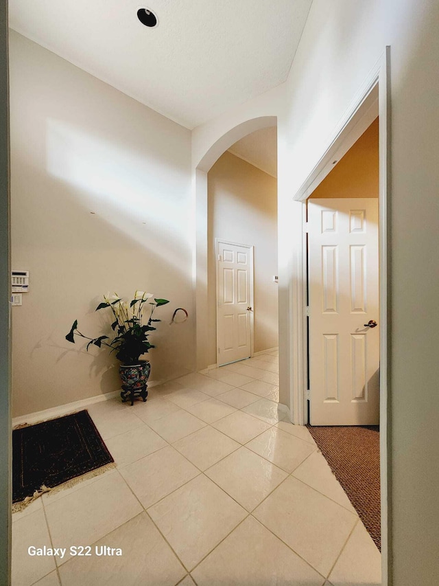 hallway featuring tile patterned floors