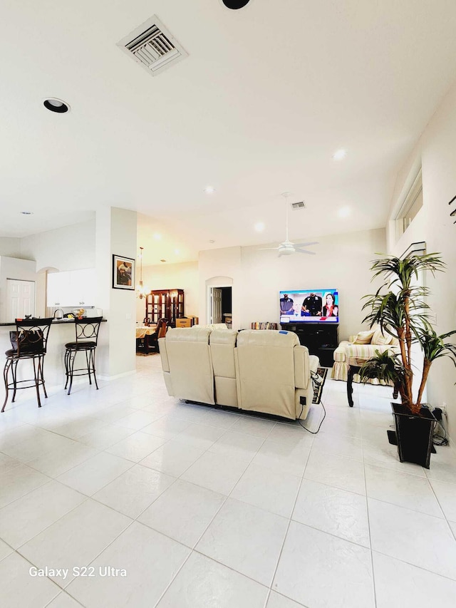 living room with light tile patterned flooring and ceiling fan