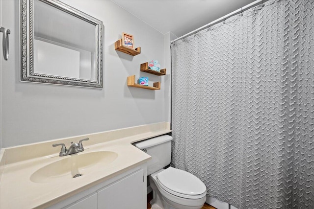 bathroom featuring vanity and toilet