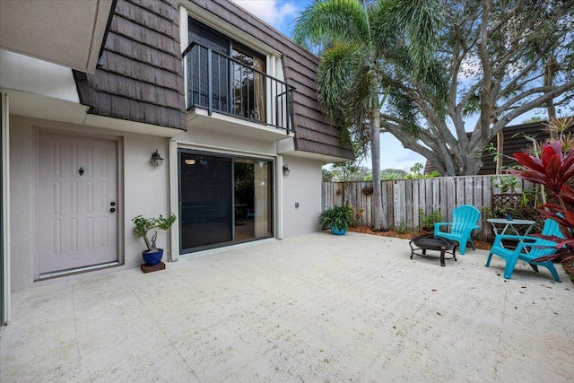 view of patio / terrace featuring an outdoor fire pit