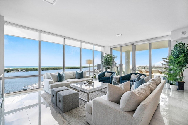 sunroom featuring plenty of natural light and a water view