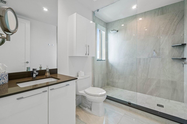 bathroom featuring tiled shower, tile patterned floors, vanity, and toilet