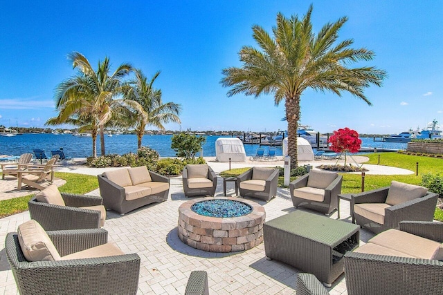 view of patio with an outdoor living space and a water view