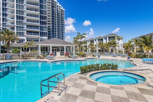 view of swimming pool with a gazebo, a hot tub, and a patio area