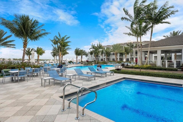 view of swimming pool with a patio