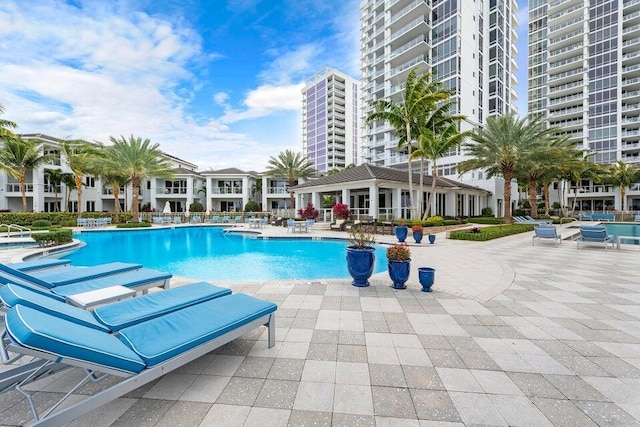 view of swimming pool with a patio