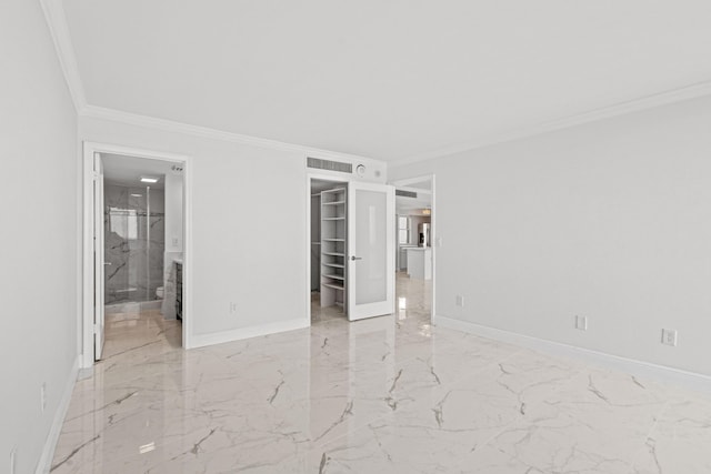 spare room with crown molding