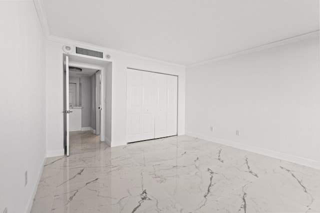 unfurnished bedroom featuring a closet and ornamental molding