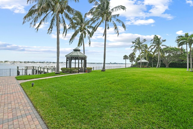 view of yard featuring a gazebo and a water view