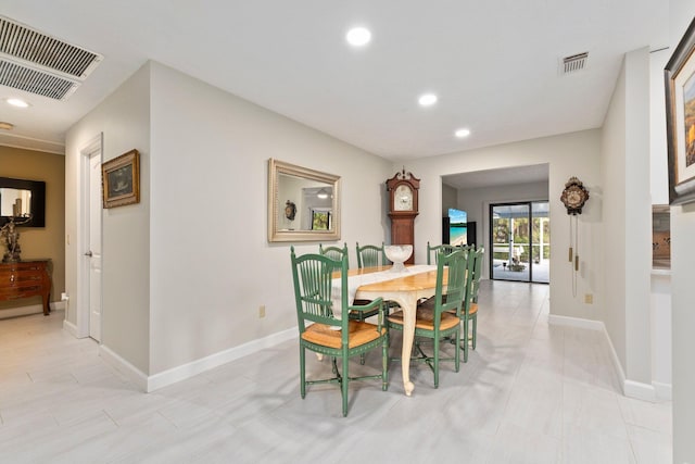 dining area featuring light tile patterned floors