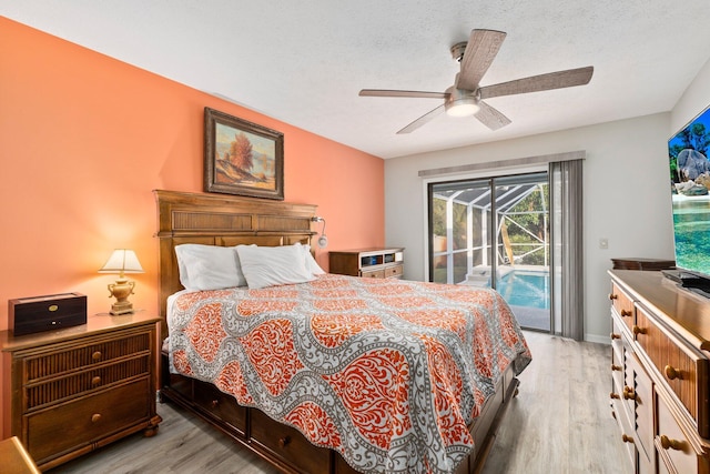 bedroom with a textured ceiling, light wood-type flooring, access to outside, and ceiling fan