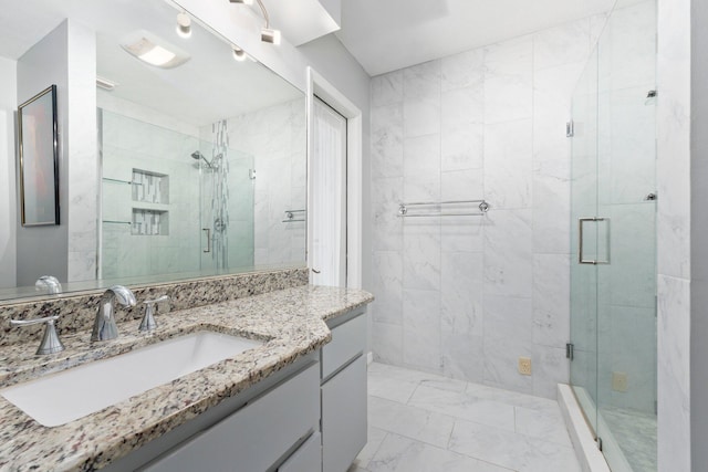 bathroom with vanity and walk in shower