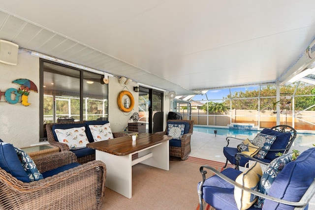 view of patio featuring an outdoor hangout area, a fenced in pool, and glass enclosure