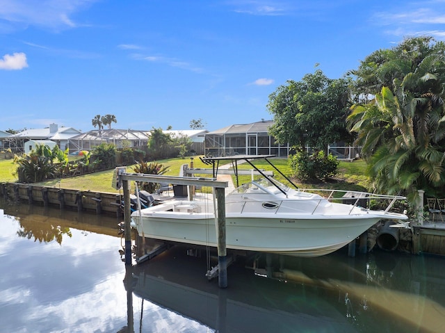 view of dock with a water view and glass enclosure