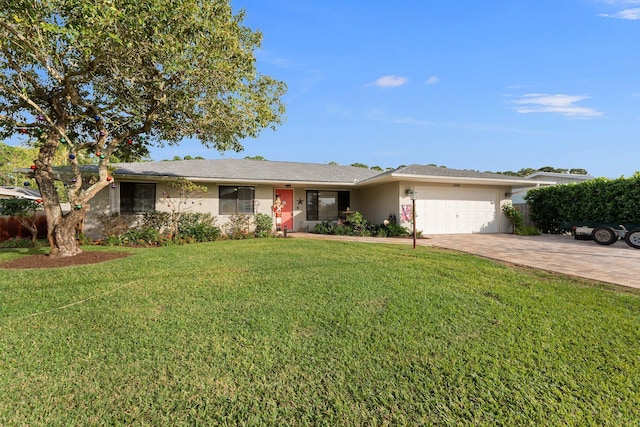 ranch-style home featuring a front yard and a garage