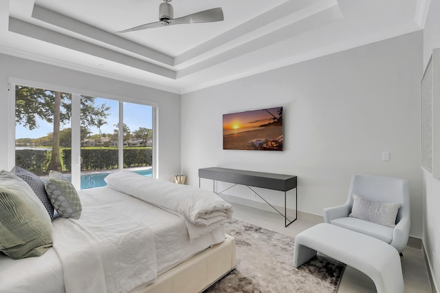 bedroom with ceiling fan, a raised ceiling, crown molding, and access to outside