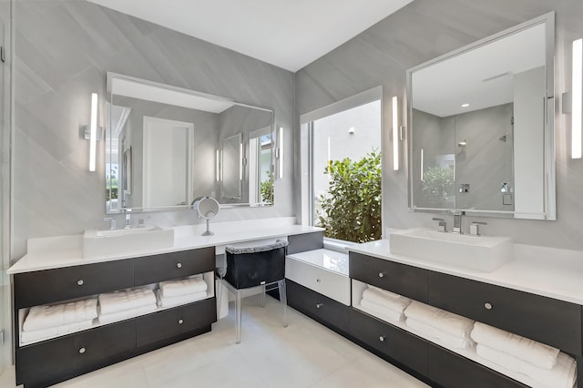 bathroom with vanity, tile patterned floors, and tile walls