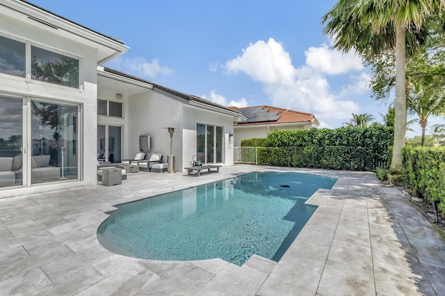 view of pool with outdoor lounge area and a patio area