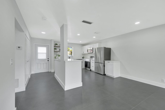 kitchen featuring appliances with stainless steel finishes and white cabinetry