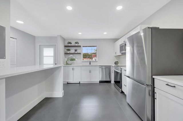 kitchen with white cabinetry, sink, and stainless steel appliances