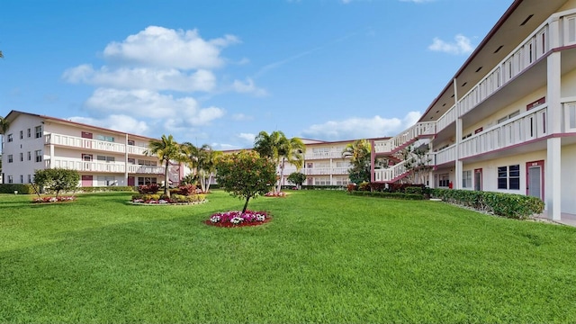 view of home's community featuring a lawn