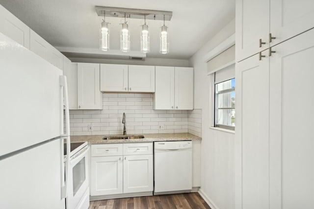 kitchen with white cabinets, white appliances, hanging light fixtures, and sink