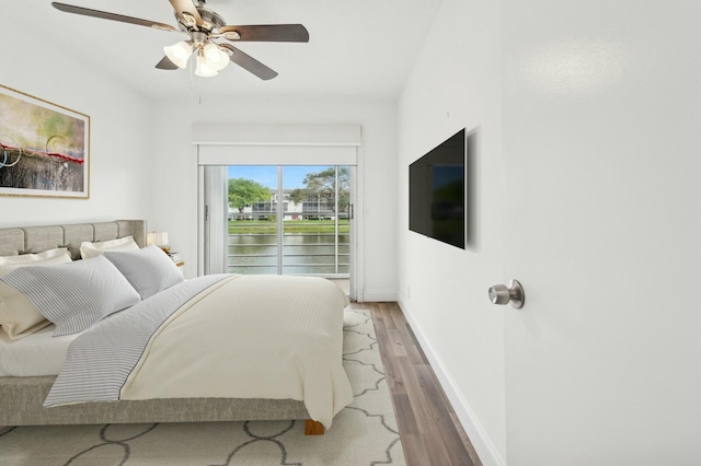 bedroom featuring ceiling fan and wood-type flooring