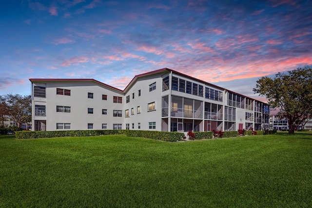 view of outdoor building at dusk