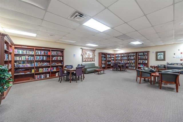 office featuring carpet flooring and a drop ceiling