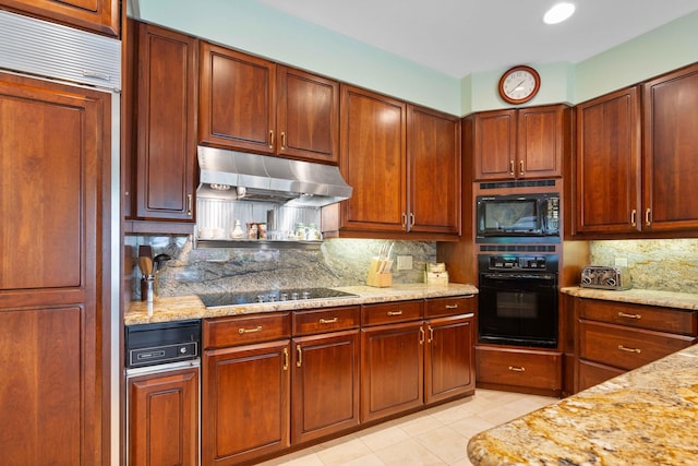 kitchen with backsplash, light stone countertops, light tile patterned floors, and black appliances