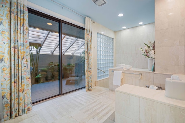 bathroom featuring tile walls