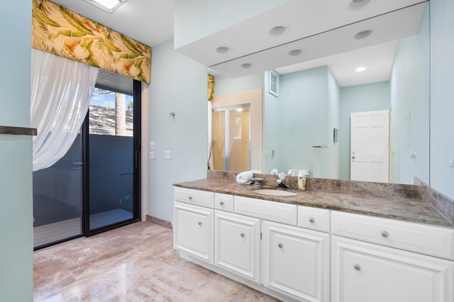 bathroom with vanity and walk in shower