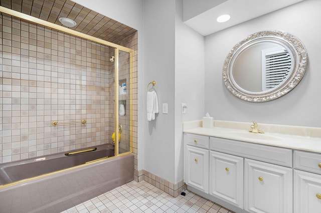 bathroom with tile patterned floors, vanity, and enclosed tub / shower combo