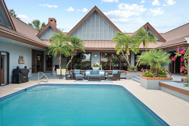 view of swimming pool with outdoor lounge area and a patio