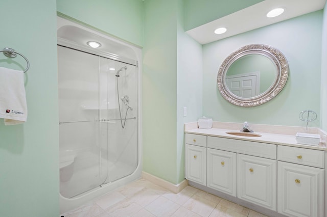 bathroom featuring vanity, tile patterned floors, and a shower with shower door