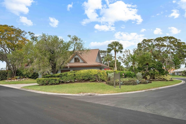 country-style home with a front lawn