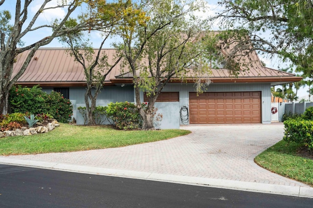 ranch-style home featuring a garage