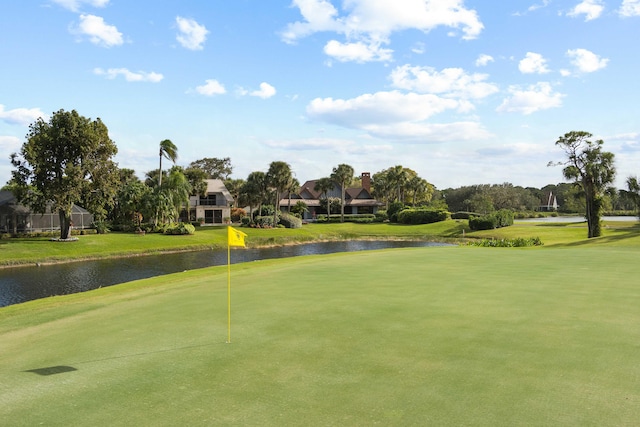 view of property's community featuring a water view and a yard