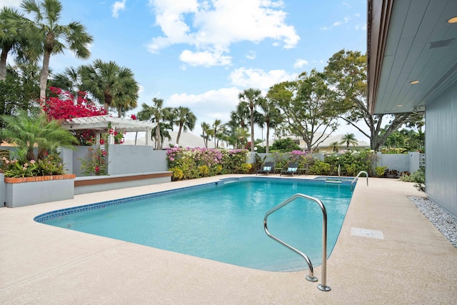 view of swimming pool with a pergola and a patio area