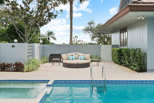 view of pool featuring outdoor lounge area and a patio area