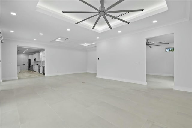 empty room featuring a raised ceiling, a ceiling fan, and recessed lighting