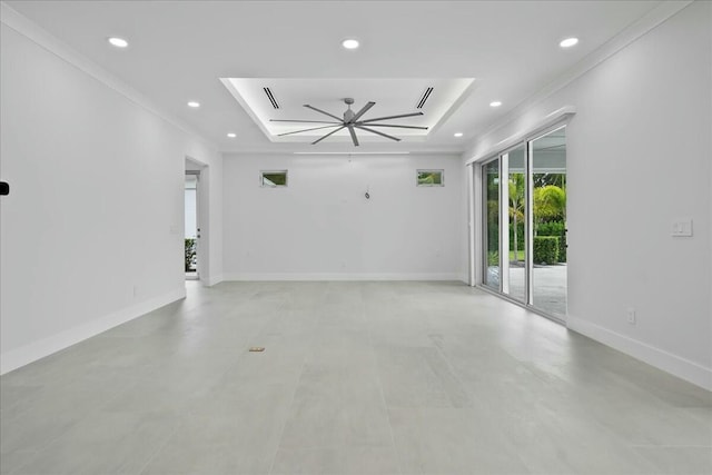 unfurnished living room featuring recessed lighting, a raised ceiling, crown molding, and baseboards